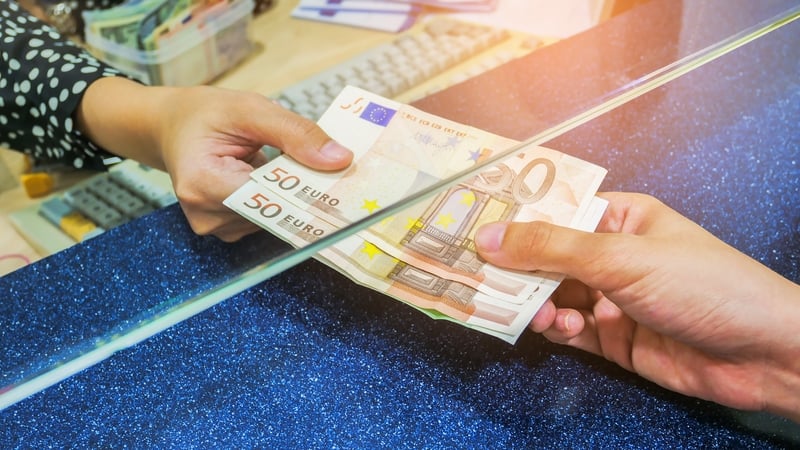 stock image shows hands holding money