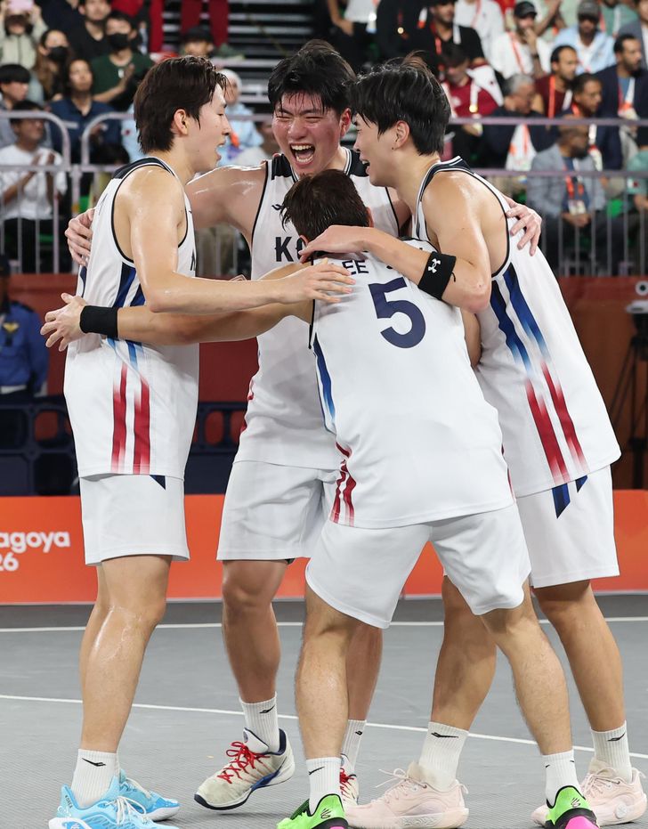 Korean players celebrate after defeating Qatar in the men's 3x3 basketball final at the 2026 Aichi-Nagoya Asian Games in Nagoya, Japan, Friday. Yonhap