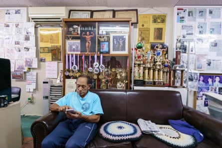 Toshisuke Kanazawa uses a smartphone in his gym in Hiroshima, Japan