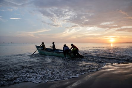 People on a rowboat in water