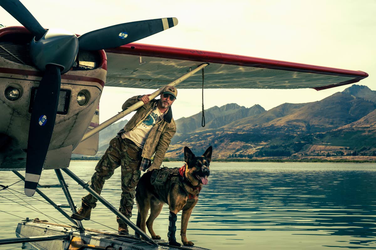 This image released by Paramount Pictures shows Brad Pitt and his German shepherd co-star in a scene from ‘Heart of the Beast’.