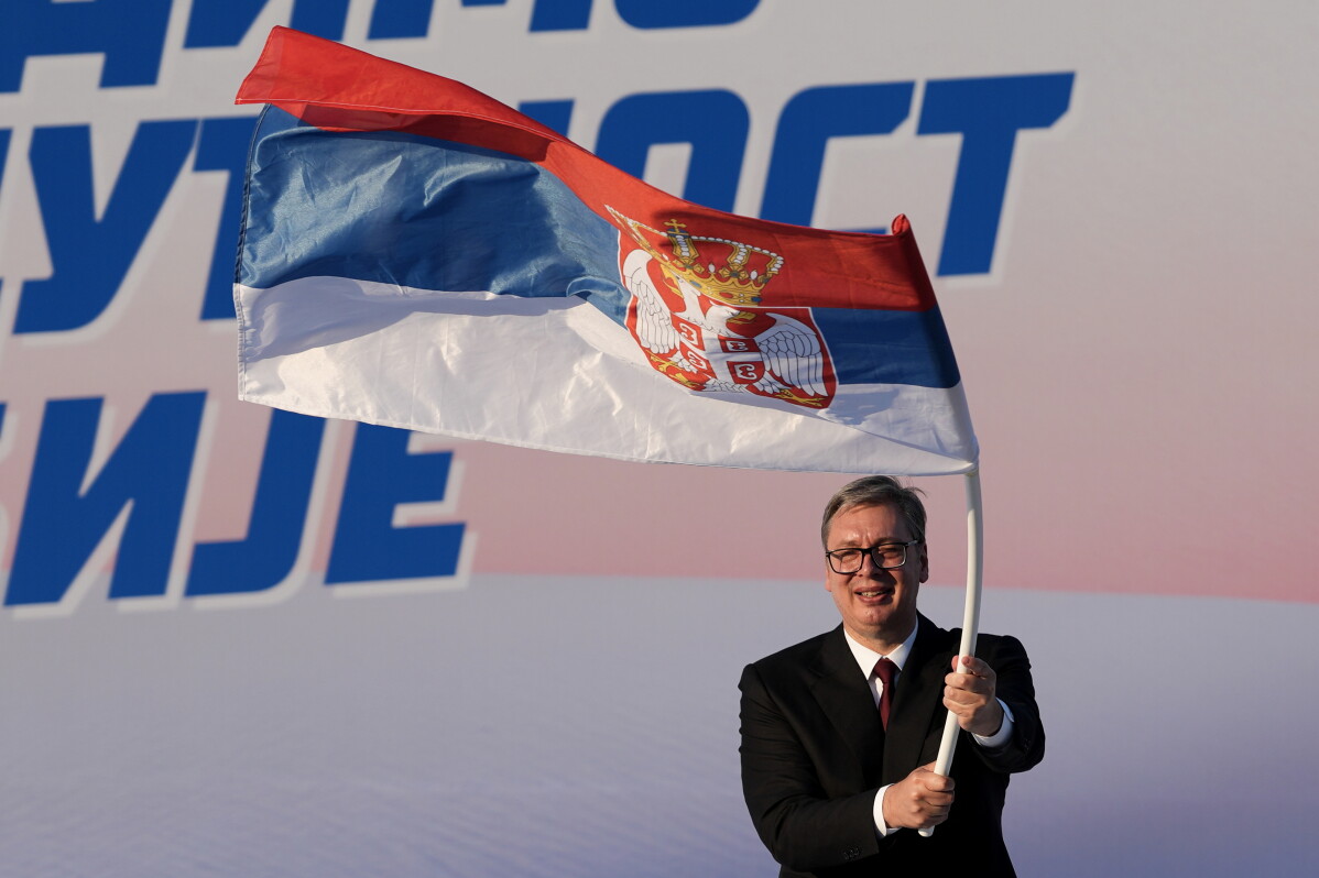 Serbian President Aleksandar Vucic waves a Serbian flag during a rally of the ruling Serbian Progressive Party (SNS) in Belgrade, Serbia, on June 27, 2026. (AP Photo/Darko Vojinovic, File)